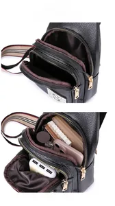 Detail view of the black lychee pattern PU leather bag showing internal storage capacity
