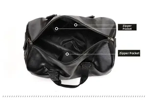 Detailed view of black leather travel bag interior featuring dual zipper pockets