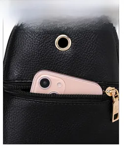 Detail of lychee textured PU leather chest bag with anti-theft zipper and earphone hole