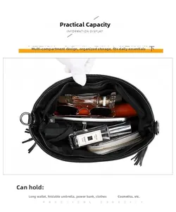 Interior view showing the large storage capacity of this soft black leather shoulder bag