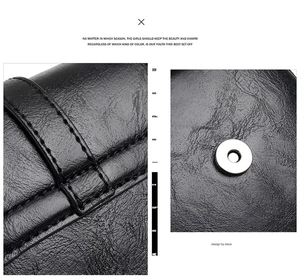 Close-up of black PU leather texture with double stitching and circular magnetic closure