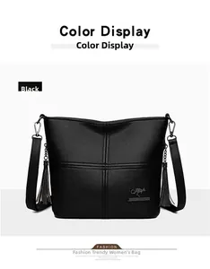 Detail of textured black faux leather handbag with kangaroo logo and side tassels