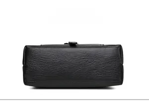 Detail view of large black PU leather bag showing clean stitching and lychee texture