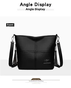 Detailed front view of black litchi pattern PU leather tote with kangaroo logo and tassel