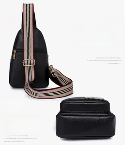 Detail of black pebbled PU leather chest bag with striped strap and gold metal buckle