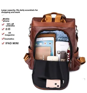 Detail view of large capacity brown PU leather backpack with anti-theft back opening