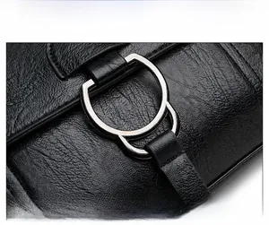 Close-up of litchi texture black PU leather with premium silver ring hardware detail