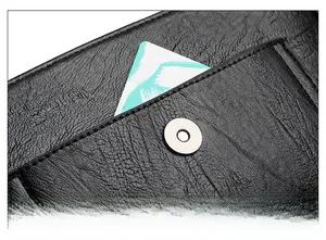 Detail of lychee pattern leather shoulder bag featuring a convenient front pocket and magnetic buckle