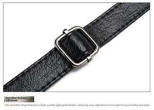 Detail of adjustable metal buckle on black litchi pattern leather shoulder bag strap