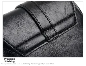 Detail shot of the precise stitching and lychee grain texture on black leather bag
