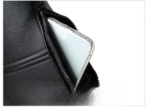 Close-up of anti-theft back zipper pocket on black lychee texture PU leather bag