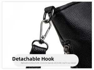 Detail view of the durable metal swivel hook and black litchi grain leather on shoulder bag