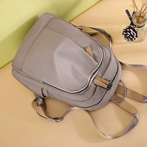 Casual grey nylon backpack with large capacity and multi-layer zippers for daily travel