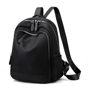 Minimalist black Oxford fabric backpack with large capacity and waterproof design for travel