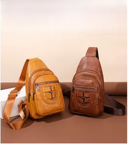 Detailed view of PU leather crossbody chest bags with woven rings and multi-pocket design