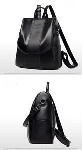 Detailed macro view of black lychee grain texture and brand logo on minimalist PU backpack