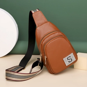 Brown lychee grain PU leather chest bag with striped strap and metal letter S detail