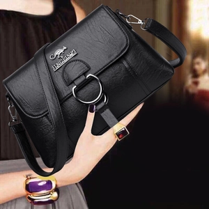 Minimalist black lychee texture PU leather crossbody bag with silver ring and kangaroo logo