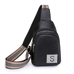 Minimalist black PU leather crossbody bag with lychee texture and striped strap
