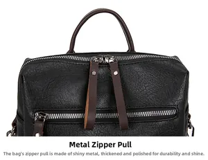 Detail of silver polished metal zipper with brown leather pull on black pebbled bag