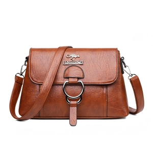 Brown PU leather crossbody bag with kangaroo logo and metallic buckle in a front view