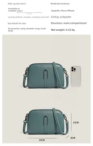 Detailed size comparison of the blue pebble leather crossbody bag with smartphone dimensions