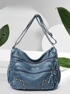 Blue vintage wash PU leather crossbody bag featuring multiple zipper pockets and rivets