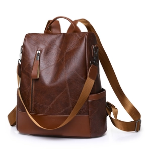 Deep brown PU leather backpack with geometric stitching and large capacity for travel