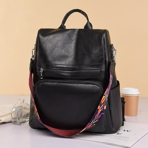 Black PU leather backpack with large capacity and colorful ethnic woven shoulder strap