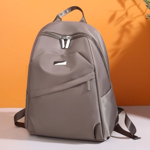 Sac à dos minimaliste en tissu Oxford grande capacité avec plaque métallique élégante