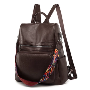 Deep brown PU leather backpack with vintage texture and colorful geometric strap
