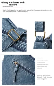 Detail of adjustable bronze hardware and zip pocket on vintage blue faux leather crossbody bag