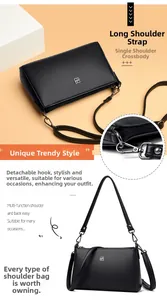 Close-up detail of detachable metal swivel hook and black litchi grain leather strap