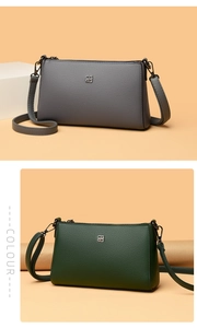 Detail of gray and dark green shoulder bags showing fine lychee leather texture and logo