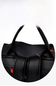 Close-up of durable oxford fabric backpack showing reinforced stitching and faux leather details