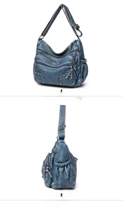 Detail view of blue washed PU leather shoulder bag with vintage rivets and zipper texture