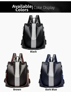 Three leather backpacks in black, brown and dark blue with shiny silver stripe detail