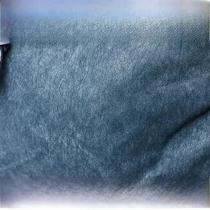 Close-up of premium dark blue washed PU leather with natural grain texture