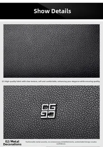 Detail of black litchi grain leather fabric and silver metal hardware logo on the shoulder bag