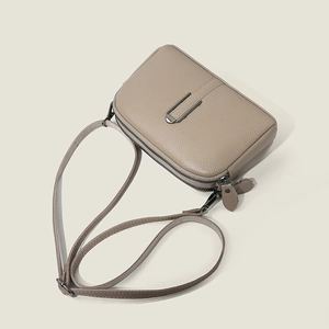 Minimalist top layer cowhide leather crossbody bag with dual zipper layers and gunmetal hardware