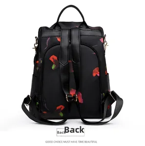 Detail view of anti-theft zipper on the back of printed Oxford fabric backpack