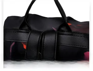 Detail shot of sturdy stitching on Oxford cloth backpack with stylish floral patterns