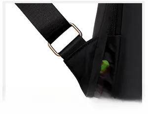 Close-up of durable golden metal buckle and reinforced strap on black oxford backpack