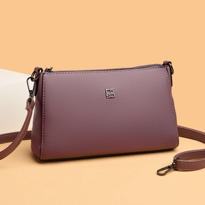 Purple lychee grain leather crossbody bag with silver logo and adjustable strap