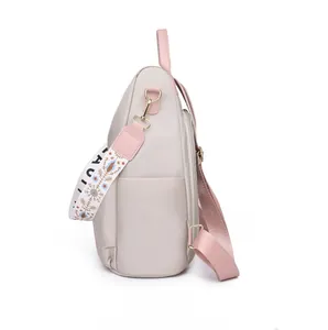 Detailed side view of nylon backpack featuring decorative floral print wide strap