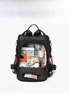 Detail view of large capacity black nylon backpack interior showing storage space