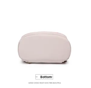Detailed bottom view of the nylon backpack showing high-density stitching and fabric