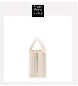 Side view of a minimalist off-white canvas tote bag showing stitching and durable fabric