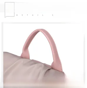 Detail view of the pink leather handle and pleated champagne satin fabric of this backpack