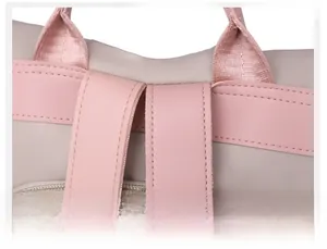 Macro shot of reinforced stitching and durable nylon fabric on pink casual backpack